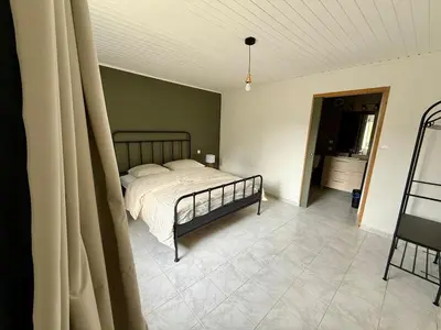 Un ou plusieurs lits dans un hébergement de l'établissement Gîte 2 suites proche du lac de Chalain