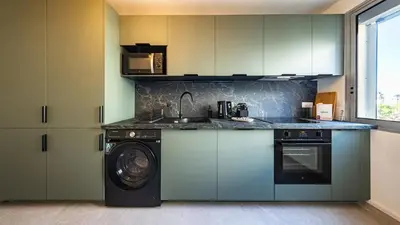Cuisine ou kitchenette dans l'établissement Rhapsodie