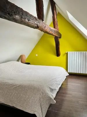 Un ou plusieurs lits dans un hébergement de l'établissement Loft atypique, charme & confort