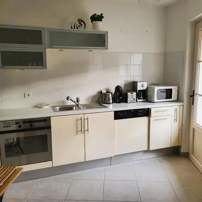 Cuisine ou kitchenette dans l'établissement L'Etalon, maison dans corps de ferme