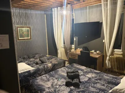 Un ou plusieurs lits dans un hébergement de l'établissement Hôtel du Centre