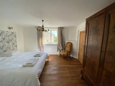Un ou plusieurs lits dans un hébergement de l'établissement Rare maison de famille au cœur des Grands Crus