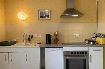Cuisine ou kitchenette dans l'établissement Les Jardins de Chevagny Parking - Jardin - 6 Personnes