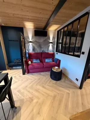 Coin salon dans l'établissement Le Petit Nid D'Amour