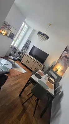 Télévision ou salle de divertissement dans l'établissement Le Bourg