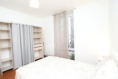 Un ou plusieurs lits dans un hébergement de l'établissement Appartement Cosy - Proche du Centre-Ville