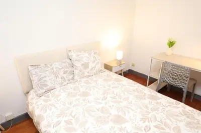 Un ou plusieurs lits dans un hébergement de l'établissement Appartement Cosy - Proche du Centre-Ville