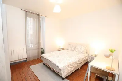 Un ou plusieurs lits dans un hébergement de l'établissement Appartement Cosy - Proche du Centre-Ville