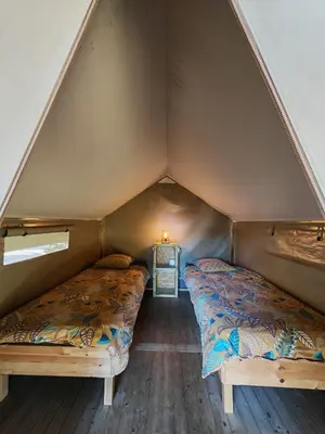 Un ou plusieurs lits dans un hébergement de l'établissement Camping Du Paquier Fané