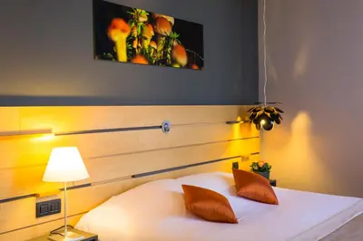 Un ou plusieurs lits dans un hébergement de l'établissement Logis Hôtel du Morvan - Restaurant la Table de Jérôme