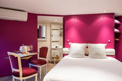 Un ou plusieurs lits dans un hébergement de l'établissement Frédéric Carrion - Cuisine, Hôtel & Spa