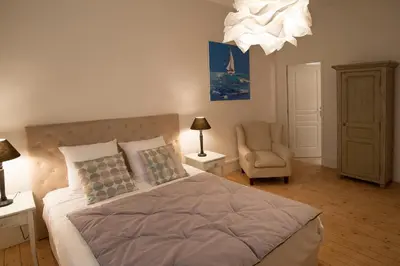 Un ou plusieurs lits dans un hébergement de l'établissement Le Cercle Chambres climatisées