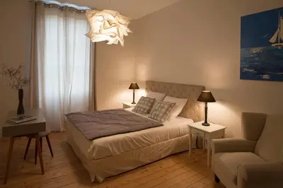 Un ou plusieurs lits dans un hébergement de l'établissement Le Cercle Chambres climatisées