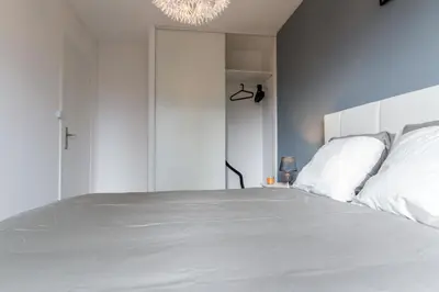 Un ou plusieurs lits dans un hébergement de l'établissement Sweet Home Dijon-Arquebuse