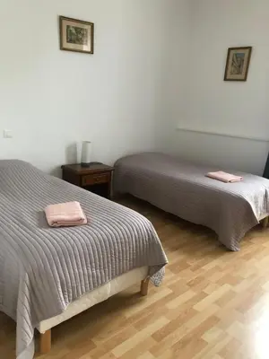 Un ou plusieurs lits dans un hébergement de l'établissement Gîte Les Minimes
