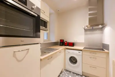 Cuisine ou kitchenette dans l'établissement Les vignes blanches
