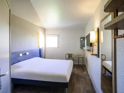 Un ou plusieurs lits dans un hébergement de l'établissement ibis budget Nuits Saint Georges