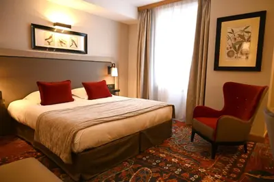 Un ou plusieurs lits dans un hébergement de l'établissement Hôtel Le Rempart