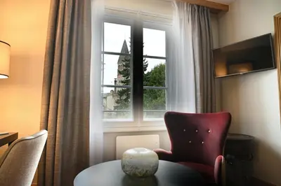 Coin salon dans l'établissement Hôtel Le Rempart