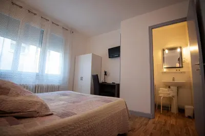 Un ou plusieurs lits dans un hébergement de l'établissement Hotel Restaurant Saint-Benoit