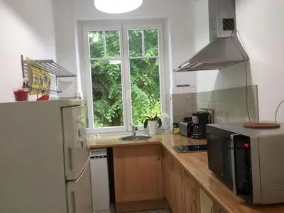 Cuisine ou kitchenette dans l'établissement IDÉAL ART DÉCO compris un parking privé sécurisé Darcy Liberté centre Gare-Ville