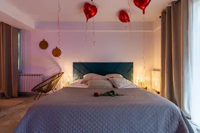 Un ou plusieurs lits dans un hébergement de l'établissement Suite and Spa 21