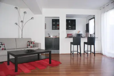 Coin salon dans l'établissement Appartement Le Louvre
