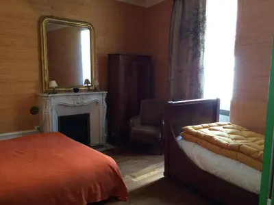 Un ou plusieurs lits dans un hébergement de l'établissement La Maison Févret