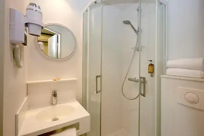 Salle de bains dans l'établissement Coto Hotel