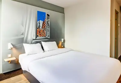 Un ou plusieurs lits dans un hébergement de l'établissement B&B HOTEL Beaune Sud 1 Palais des Congrès