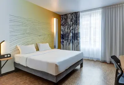 Un ou plusieurs lits dans un hébergement de l'établissement B&B HOTEL Dijon Centre