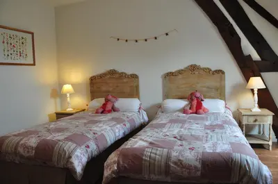 Un ou plusieurs lits dans un hébergement de l'établissement La ferme d'aristide