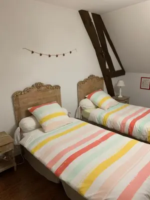 Un ou plusieurs lits dans un hébergement de l'établissement La ferme d'aristide