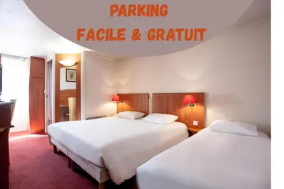 Un ou plusieurs lits dans un hébergement de l'établissement Hôtel Inn Design Mâcon Nord - Sancé