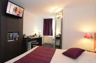 Un ou plusieurs lits dans un hébergement de l'établissement Hôtel Inn Design Dijon Est - Quetigny