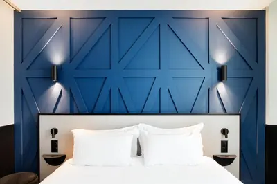 Un ou plusieurs lits dans un hébergement de l'établissement Logis Hotel Darcy Dijon Centre