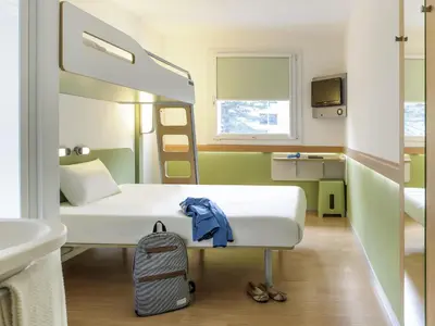 Un ou plusieurs lits dans un hébergement de l'établissement ibis Budget Lons-le-Saunier