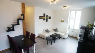 Coin salon dans l'établissement Le Puligny, appartement classé 3 étoiles