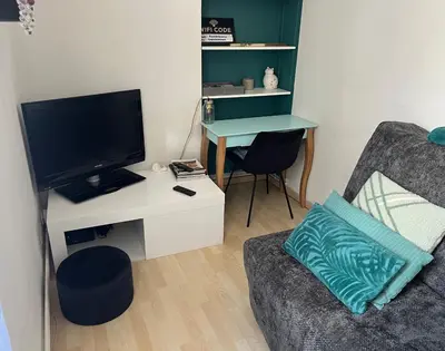 Télévision ou salle de divertissement dans l'établissement Chez Barbara