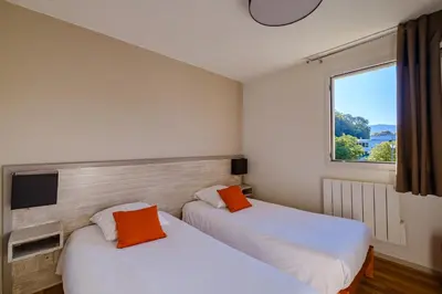 Un ou plusieurs lits dans un hébergement de l'établissement Residence Des Thermes