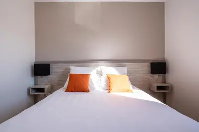 Un ou plusieurs lits dans un hébergement de l'établissement Residence Des Thermes