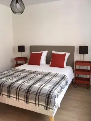 Un ou plusieurs lits dans un hébergement de l'établissement Appartements Le Cru Colbert