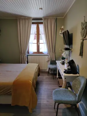 Un ou plusieurs lits dans un hébergement de l'établissement Auberge de La Chaloire
