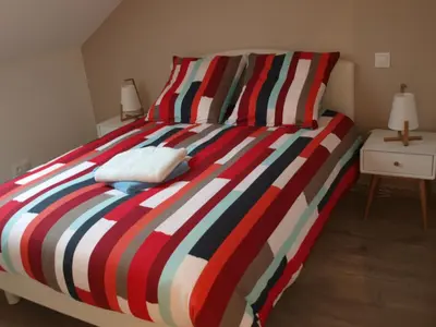 Un ou plusieurs lits dans un hébergement de l'établissement Cottage nuiton