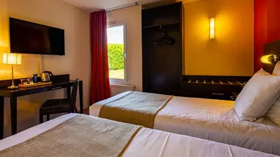 Un ou plusieurs lits dans un hébergement de l'établissement Logis Hostellerie D'Aussois