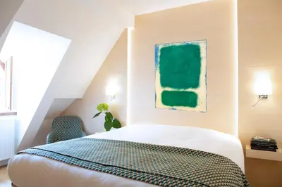 Un ou plusieurs lits dans un hébergement de l'établissement Hotel Le Clos De La Vouge