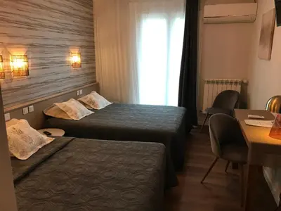 Un ou plusieurs lits dans un hébergement de l'établissement Hôtel Saint Philibert