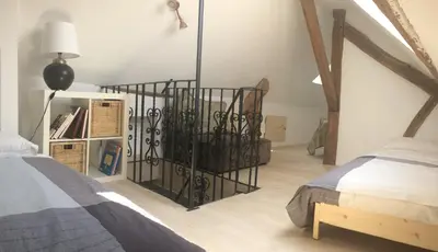 Un ou plusieurs lits dans un hébergement de l'établissement Au Coeur de Nuits