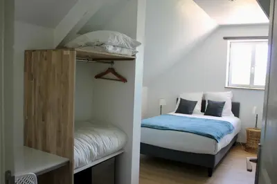 Un ou plusieurs lits dans un hébergement de l'établissement Le Carre Saint Pierre - Chambres d'hôtes