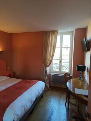 Un ou plusieurs lits dans un hébergement de l'établissement Hôtel La Reconce